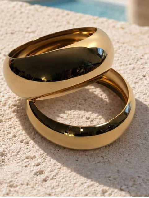 Front view of the Lila two piece gold bangle set with smooth rounded shapes