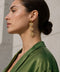 gold heart-shaped drop earring with soft pink centre stones with a gold hear border