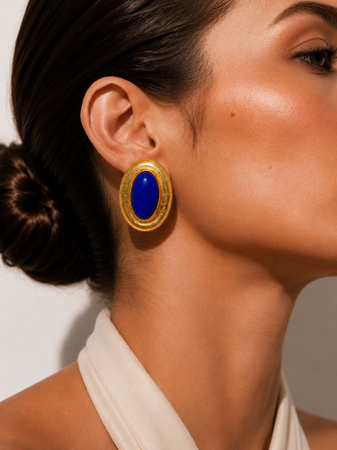 Hand made stud earrings with blue  gemstone in a vintage inspired textured gold setting.