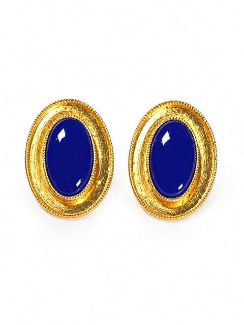 Close up of blue stone and gold earrings in a oval shape elegant women's fashion jewellery.