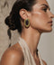 Rhodes Earrings featuring Brown Cat Eye stones in an oval gold setting.