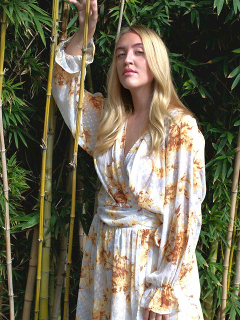 Harlow G amber spice relaxed fit wrap top with long sleeves in floral print in warm amber tones, paired with matching skirt