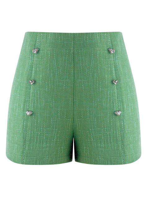 Harlow G Capri Charm green shorts with heart button detailing textured surface mid rise waist and structured silhouette
