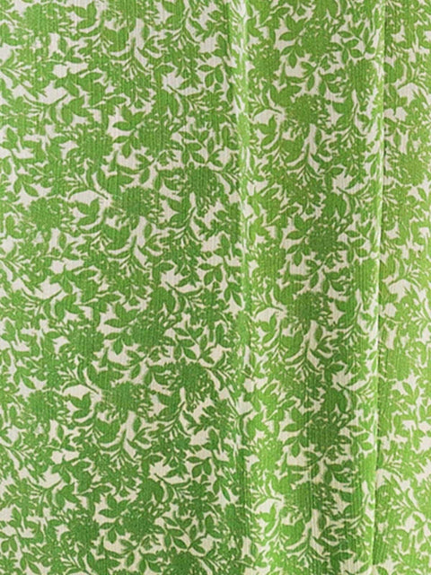 Harlow G close up view of Malaga Maxi Skirt green floral print fabric