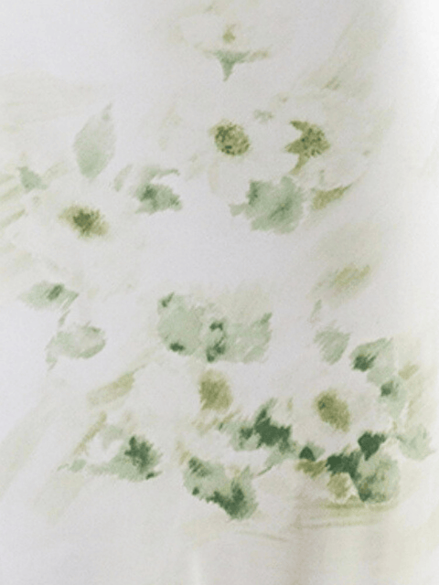 Harlow G close up La Mer soft green florals on ivory fabric