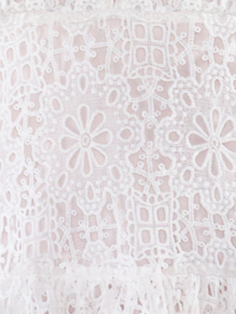 Harlow G close detail of Tua Blanca Mini Dress in white floral broderie anglaise fabric with embroidered cutwork pattern