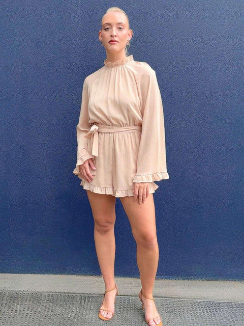 Harlow G Brooklyn Lights Playsuit pink playsuit with high frill neckline waist tie detail long sleeves and relaxed fit