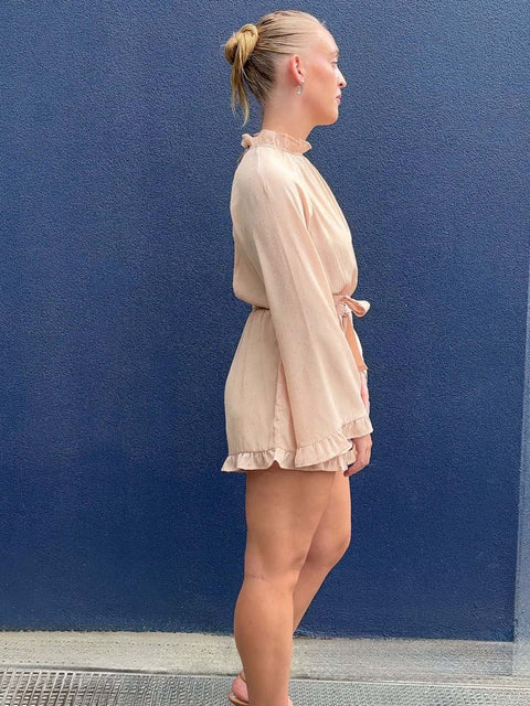Harlow G Brooklyn Lights Playsuit pink playsuit with long sleeves waist tie detail and frill hem silhouette