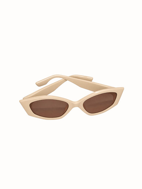 thick beige frame sunglasses and light brown lenses.